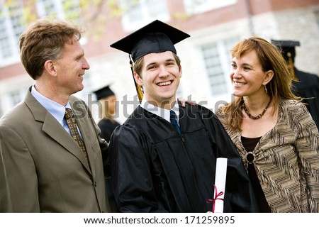 Graduation: Proud Male Student With Parents