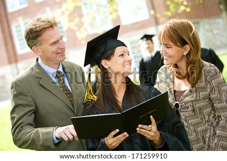 Graduation: Parents Looks At Graduate'S Diploma