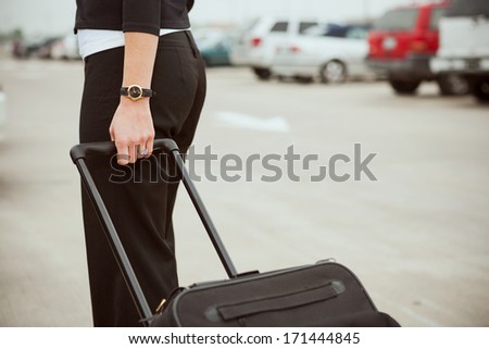 Travel: Anonymous Woman Pulling Carry-On Bag