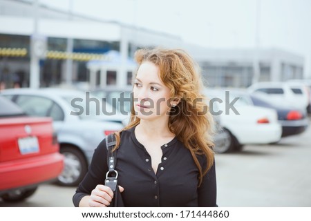 Travel: Woman In Airport Parking Lot With Shoulder Bag