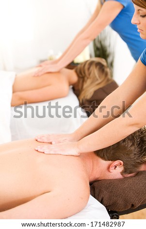 Massage: Couple Receives Shoulder Massage