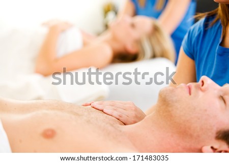 Massage: Man on Back Receives Shoulder Massage