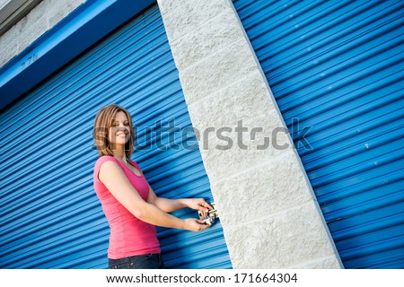 Storage: Smiling Woman Opening Unit