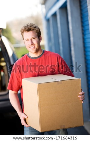 Storage: Man Carrying Box From Truck