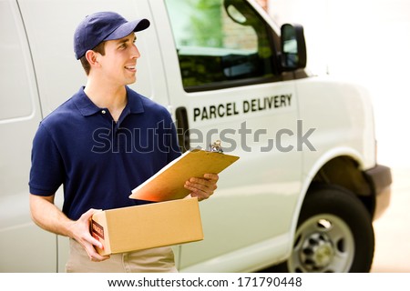 Delivery: Standing Near the Van With Clipboard and Package