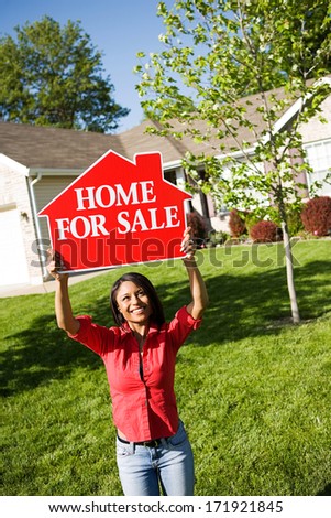 Real Estate: Home Seller Holding Up Sign