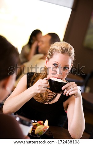 Coffee Shop: Woman Drinking Coffee With Whipped Cream