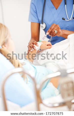 Hospital: Nurse Attends to Child\'s IV Line