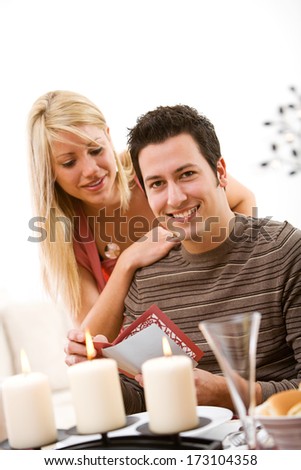 Valentine: Smiling Man Gets Valentine Card During Dinner