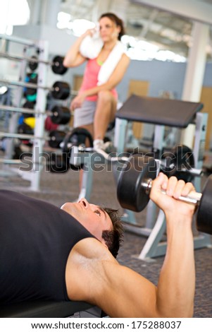 Gym: Man On Bench Using Dumbbells