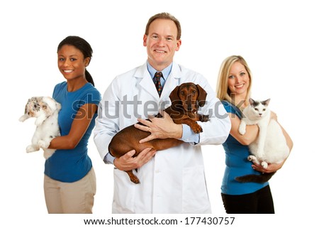 Veterinarian: Group Of Vets and Assistants Holding Pets
