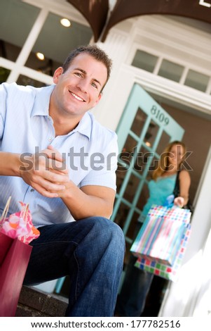 Boutique: Main Waits For Woman Outside of Store