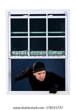 Burglar: Man Breaking Into House Through Window