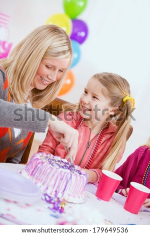 Birthday: Girl Waiting For Mother To Cut Cake