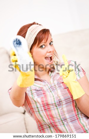 Cleaning: Woman Holds Out Scrub Brush