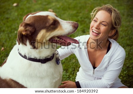 Park: Woman And Dog Laugh Together In Park