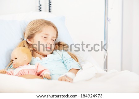 Hospital: Little Girl Asleep In Hospital Bed With Doll