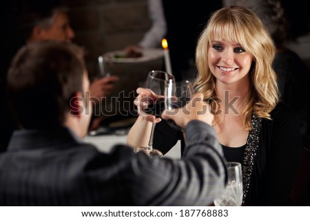 Restaurant: Man And Woman Share Celebratory Toast