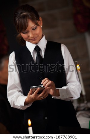 Restaurant: Server Takes Order On Digital Tablet