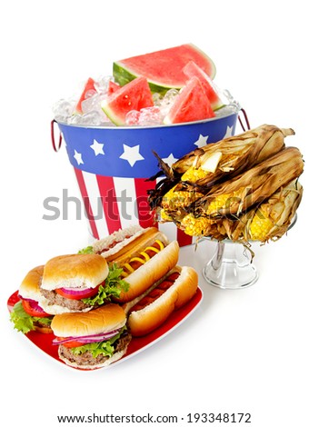Summer July 4th Party Bucket With Watermelon Next To Burgers Hot Dogs and Corn Summer July 4th Party Bucket With Watermelon Next To Burgers Hot Dogs and Corn