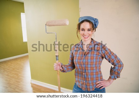 Moving: Smiling Woman Painting New Apartment