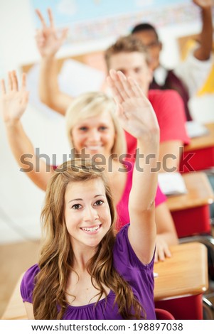 Classroom: Students All Raise Hand To Answer