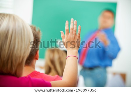 Classroom: Student Raises Hand To Answer Question
