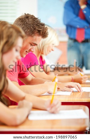 Classroom: Row Of Students Taking High School Test