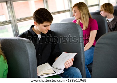 School Bus: Male High School Student Studies On Bus