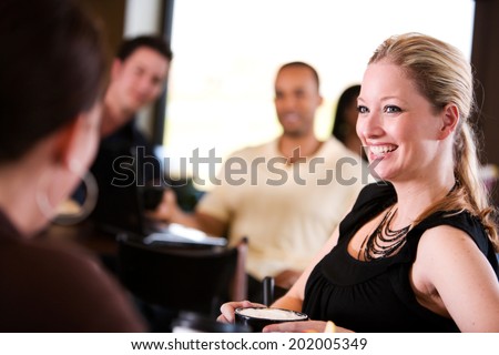 Bistro: Women Laugh At Flirting Men
