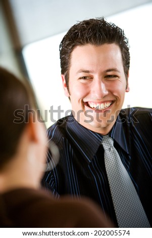 Bistro: Smiling Businessman With Co-worker At Lunch