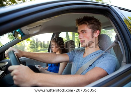 Driving: Smart Male Teen Driver Paying Attention To Road