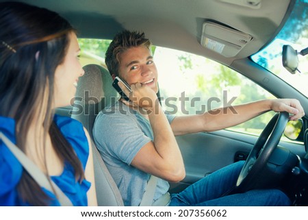 Driving: Boy Talks On Phone And To Passenger Instead Of Paying Attention