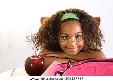 Student: Smiling Girl Rests On Hands Before Doing Schoolwork