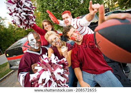 Tailgating: Group Of Excited Fans Cheer For Team