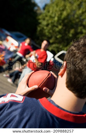 Tailgate: Friends Play Football At Tailgating Party