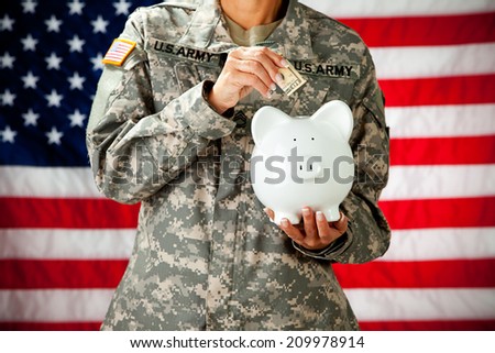 Soldier: Military Female Putting Money In Piggy Bank
