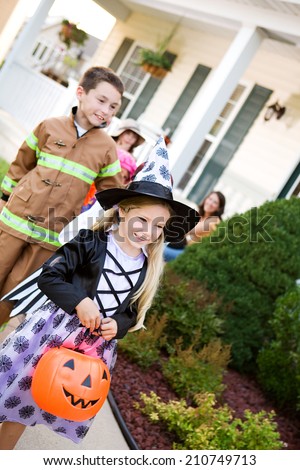 Halloween: Friends In Costume Walk To Next House To Trick Or Treat