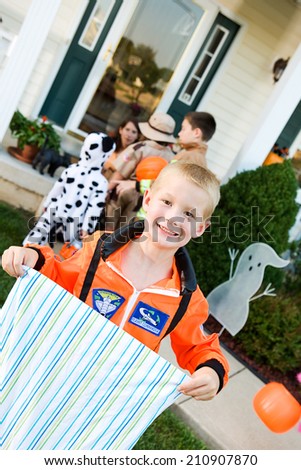 Halloween: Boy Astronaut Trick Or Treating For Halloween