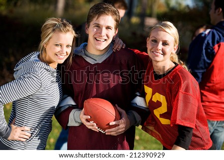 Football: Guy Hanging Out With Girl Friends Playing Ball