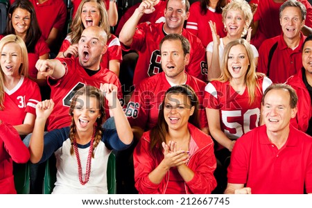 Fans: Crowd Of Cheering Football Fans In Stadium Seats