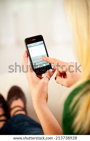 St. Louis, Missouri, USA - March 9, 2011: Woman Ready To Type Email On Apple iPhone 4