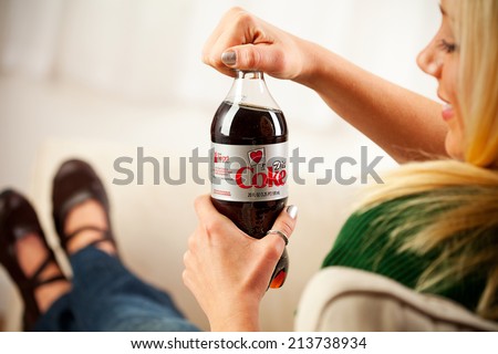 St. Louis, Missouri, USA - March 9, 2011: Woman Opening Bottle Of Diet Coke Produced By The Coca-Cola Company