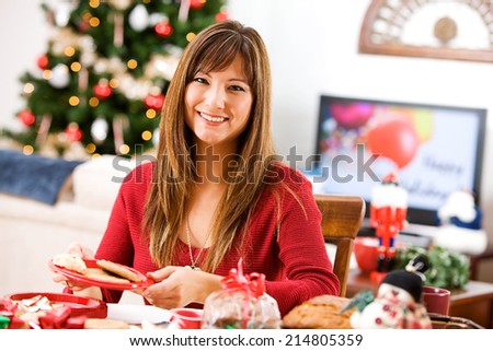 Christmas: Smiling Woman Wrapping Up Gifts Of Homemade Baked Goods