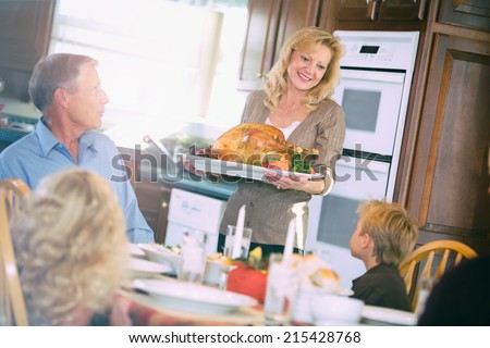Thanksgiving: Mother Brings Holiday Roast Turkey To Table