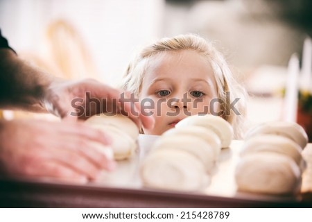 Thanksgiving: Little Girl Hungry For Baked Rolls