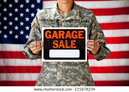 Politician: Soldier Holding Up Garage Sale Sign