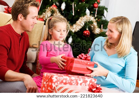 Holidays: Family Having Fun Opening Presents On Christmas