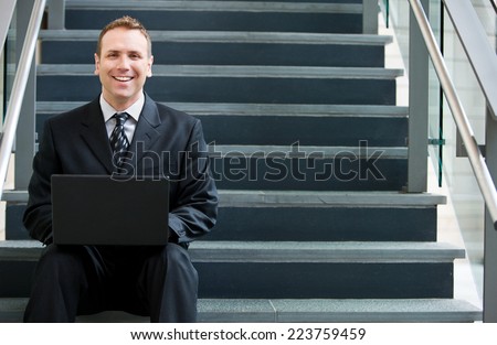 Businessman Gets Out Of Office To Work With Laptop