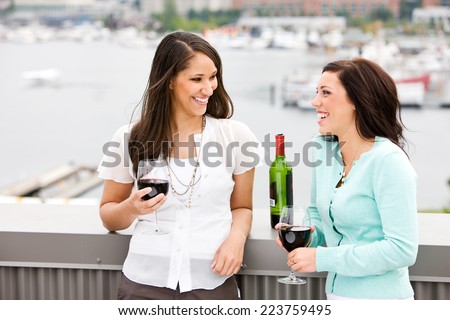 Wine: Friends Sharing A Glass Of Wine On The Rooftop